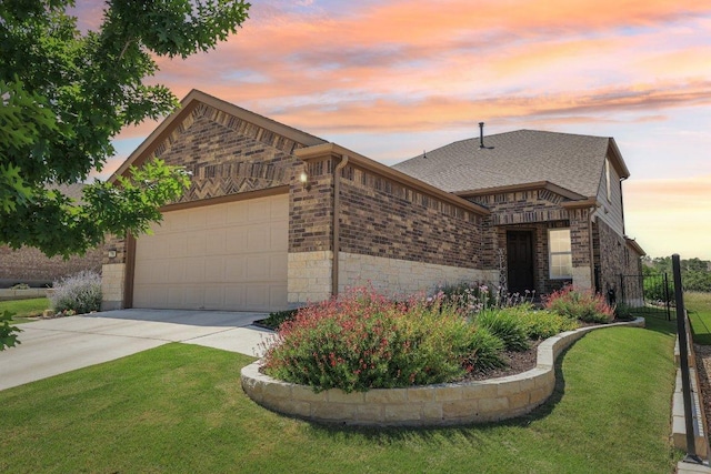 709 Kitty Hawk Rd, Georgetown, TX 78633 - view of front of home featuring a garage, driveway, stone siding, and brick siding