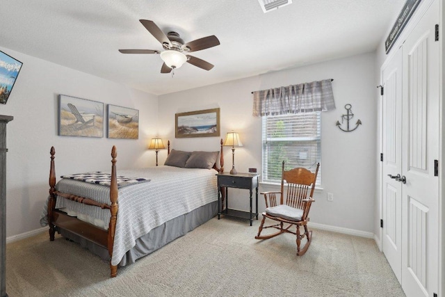 709 Kitty Hawk Rd, Georgetown, TX 78633 - bedroom with a closet, light colored carpet, baseboards, and a ceiling fan