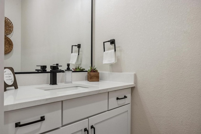 2 Basswood Cir, Wimberley, TX 78676 - bathroom with vanity and a textured wall