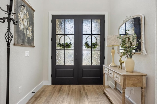 2 Basswood Cir, Wimberley, TX 78676 - entrance foyer featuring french doors, healthy amount of natural light, and baseboards