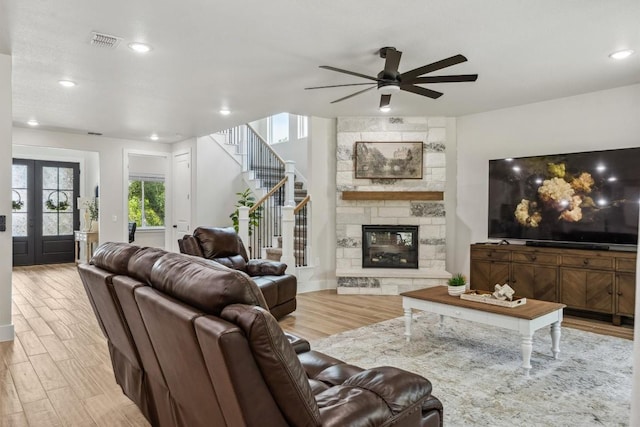 2 Basswood Cir, Wimberley, TX 78676 - living room featuring a ceiling fan, light wood finished floors, recessed lighting, stairway, and a fireplace
