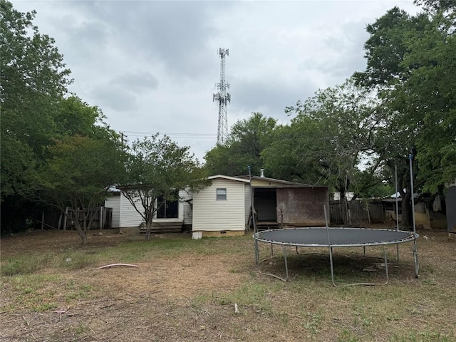 2505 Gardenia Dr, Austin, TX 78727 - back of house with a trampoline, crawl space, and entry steps