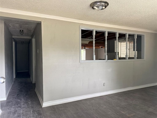 2505 Gardenia Dr, Austin, TX 78727 - empty room featuring a textured ceiling, wood finished floors, ornamental molding, and baseboards