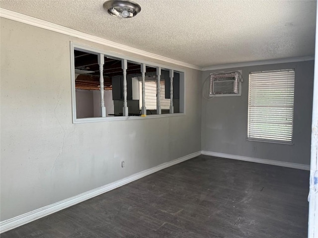 2505 Gardenia Dr, Austin, TX 78727 - empty room featuring a textured ceiling, wood finished floors, a wall unit AC, ornamental molding, and baseboards