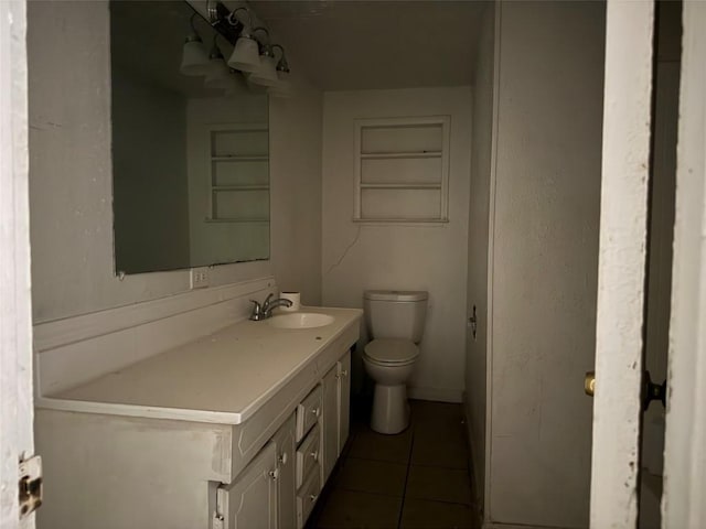 2505 Gardenia Dr, Austin, TX 78727 - bathroom featuring vanity, tile patterned floors, and toilet