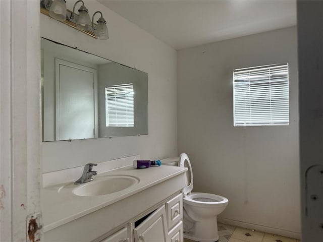 2505 Gardenia Dr, Austin, TX 78727 - half bath featuring vanity, toilet, and tile patterned floors