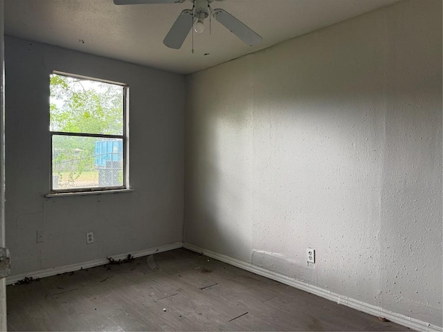 2505 Gardenia Dr, Austin, TX 78727 - empty room with baseboards, wood finished floors, and a ceiling fan