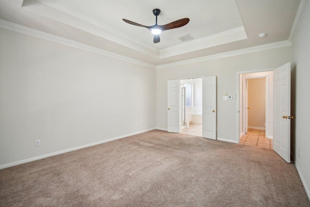 5616 Gorham Glen Ln, Austin, TX 78739 - unfurnished bedroom featuring a raised ceiling, light carpet, ornamental molding, baseboards, and connected bathroom