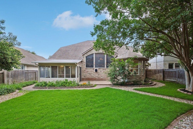 5616 Gorham Glen Ln, Austin, TX 78739 - back of house with a sunroom, brick siding, and roof with shingles