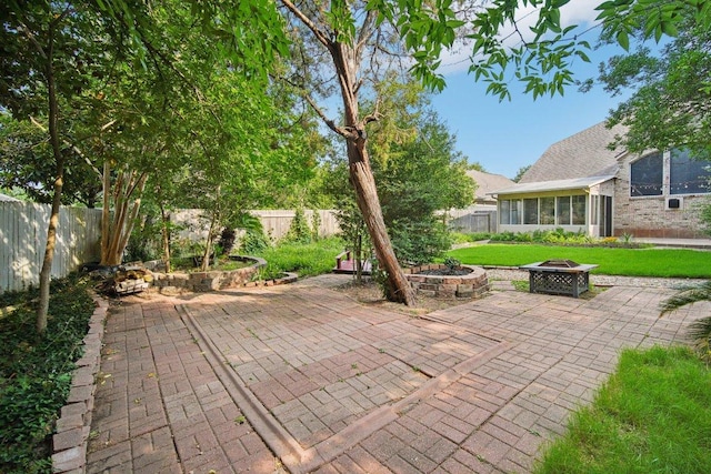 5616 Gorham Glen Ln, Austin, TX 78739 - view of patio / terrace featuring an outdoor fire pit and a sunroom