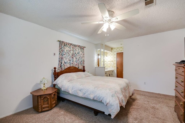 301 Navajo Trl, Georgetown, TX 78633 - bedroom with light carpet, a ceiling fan, and a textured ceiling