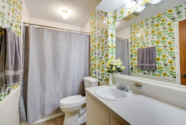 301 Navajo Trl, Georgetown, TX 78633 - bathroom featuring a textured ceiling, vanity, toilet, and a shower with shower curtain