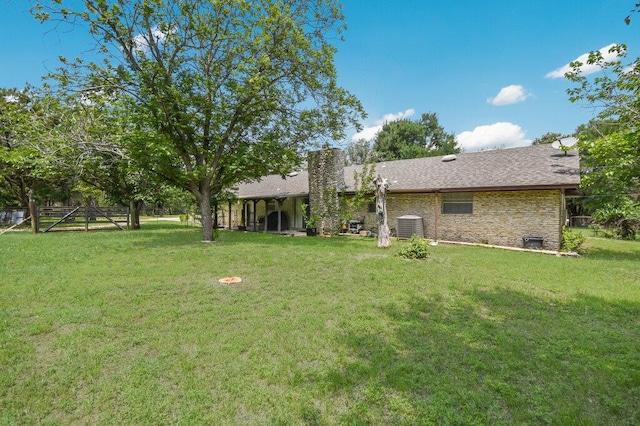 301 Navajo Trl, Georgetown, TX 78633 - rear view of property with central AC unit and a chimney