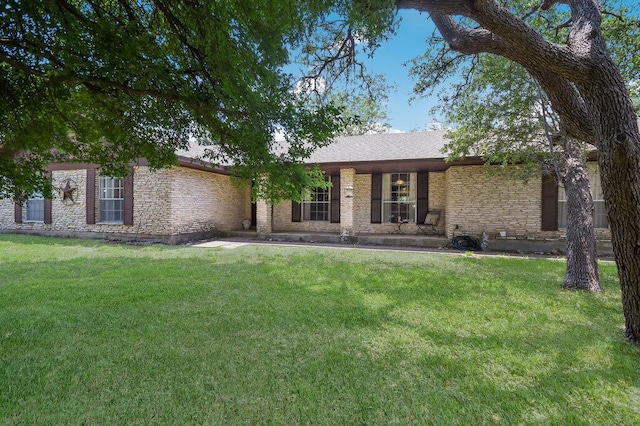 301 Navajo Trl, Georgetown, TX 78633 - ranch-style home with a front lawn and stone siding