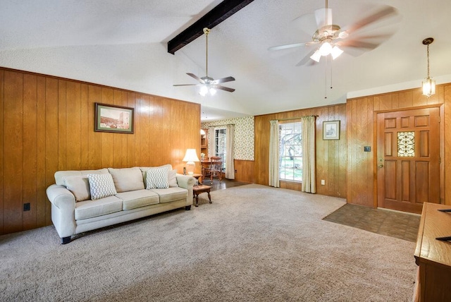 301 Navajo Trl, Georgetown, TX 78633 - carpeted living room featuring a ceiling fan and wooden walls