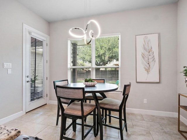 116 Claiborne Lake Ln, Georgetown, TX 78628 - dining room featuring healthy amount of natural light, a chandelier, and light tile patterned flooring