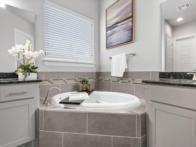116 Claiborne Lake Ln, Georgetown, TX 78628 - full bathroom with vanity and a garden tub