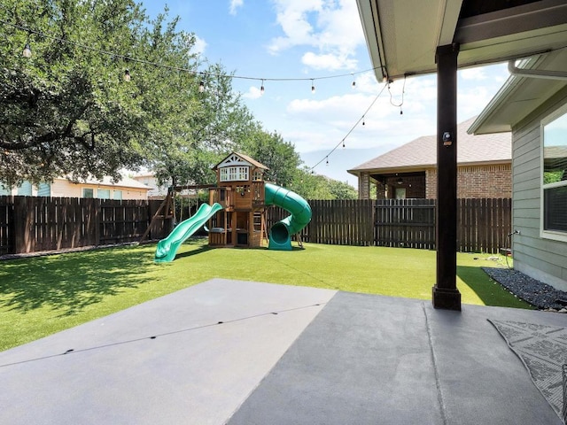 116 Claiborne Lake Ln, Georgetown, TX 78628 - fenced backyard featuring a playground and a patio