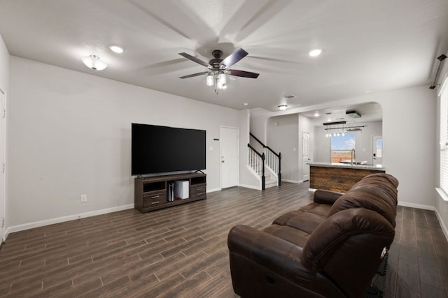 854 Pumpkin Rdg, New Braunfels, TX 78130 - living room featuring ceiling fan, baseboards, dark wood finished floors, stairs, and recessed lighting