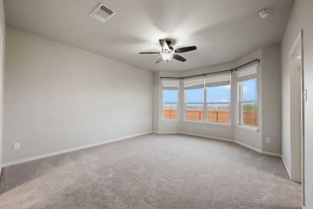 854 Pumpkin Rdg, New Braunfels, TX 78130 - spare room with carpet, ceiling fan, baseboards, and a smoke detector