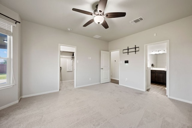 854 Pumpkin Rdg, New Braunfels, TX 78130 - unfurnished bedroom with light colored carpet, a spacious closet, baseboards, and ensuite bath