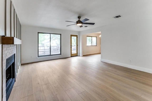 7702 Turquoise Trl, Austin, TX 78749 - unfurnished living room with ceiling fan, baseboards, and light wood-style flooring