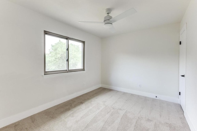 7702 Turquoise Trl, Austin, TX 78749 - spare room featuring light carpet, baseboards, and ceiling fan