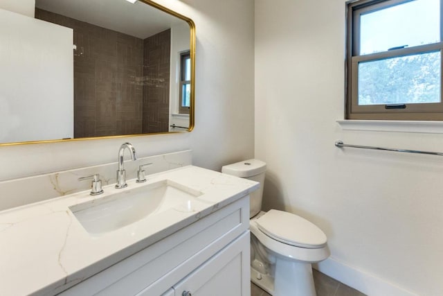 7702 Turquoise Trl, Austin, TX 78749 - full bathroom with toilet, vanity, tile patterned floors, and a shower