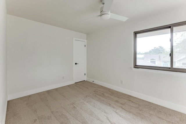 7702 Turquoise Trl, Austin, TX 78749 - spare room featuring carpet flooring, ceiling fan, and baseboards