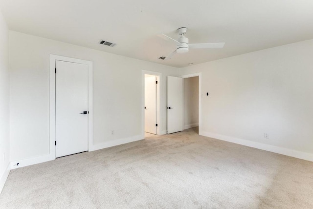 7702 Turquoise Trl, Austin, TX 78749 - unfurnished bedroom featuring light carpet, baseboards, and a ceiling fan