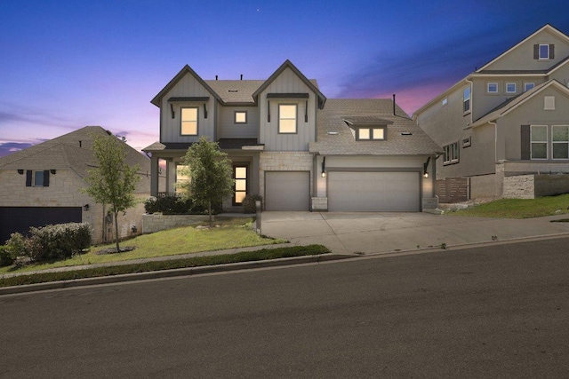 16825 Roselin Dr, Austin, TX 78738 - view of front of property featuring board and batten siding, concrete driveway, stone siding, and an attached garage