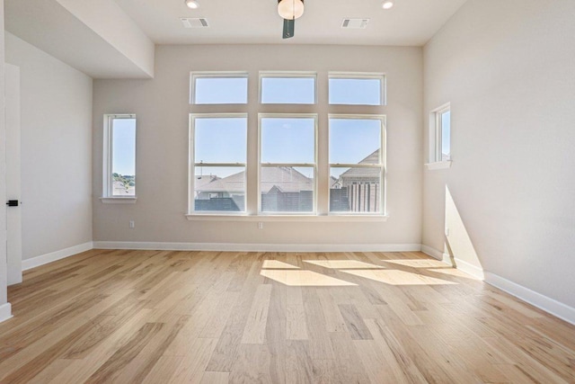 16825 Roselin Dr, Austin, TX 78738 - spare room featuring light wood-type flooring, healthy amount of natural light, and baseboards