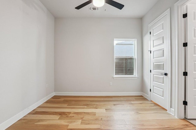 16825 Roselin Dr, Austin, TX 78738 - empty room with a ceiling fan, light wood-style flooring, and baseboards