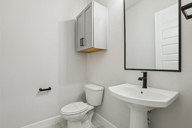 16825 Roselin Dr, Austin, TX 78738 - half bath featuring baseboards, toilet, and a sink