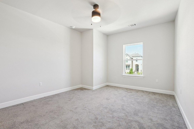 16825 Roselin Dr, Austin, TX 78738 - unfurnished room with light colored carpet, ceiling fan, and baseboards