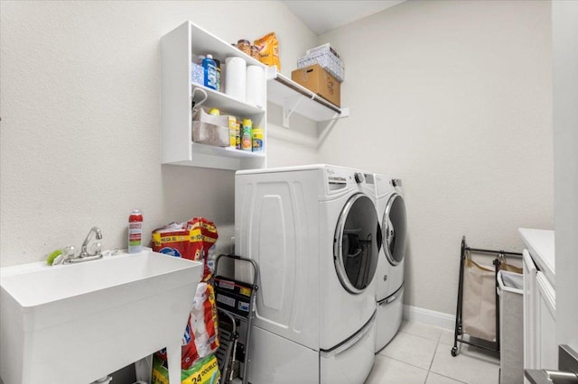 1504 Saddlespur Ln, Leander, TX 78641 - laundry room with separate washer and dryer and light tile patterned flooring