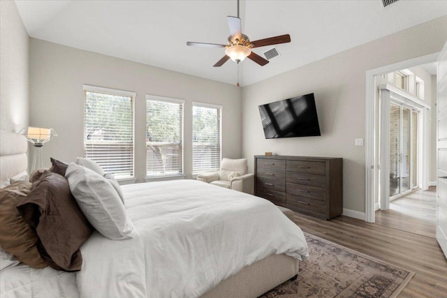 1504 Saddlespur Ln, Leander, TX 78641 - bedroom with wood finished floors, baseboards, and a ceiling fan