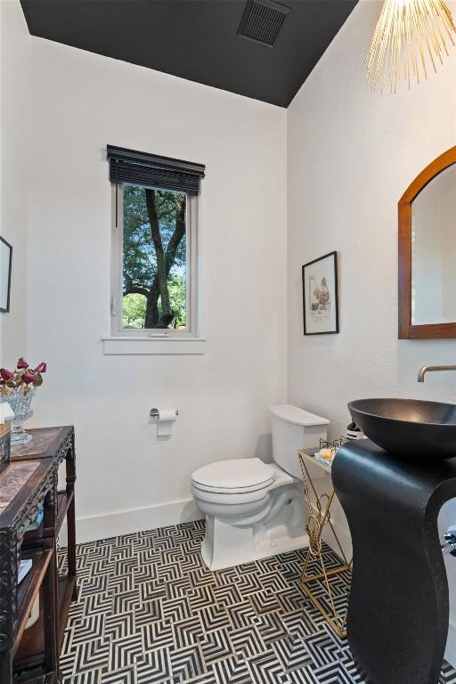 104 Sendera Bonita, Lakeway, TX 78734 - half bath with a sink and tile patterned floors