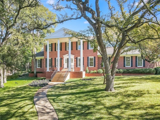 203 Wallis Dr, Austin, TX 78746 - neoclassical / greek revival house with brick siding and a front yard