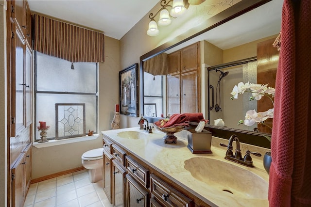2804 Rock Way, Austin, TX 78746 - full bathroom with toilet, an enclosed shower, double vanity, tile patterned flooring, and baseboards