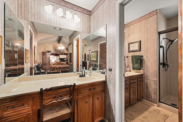 2804 Rock Way, Austin, TX 78746 - ensuite bathroom with wallpapered walls, lofted ceiling, vanity, a shower stall, and a textured ceiling
