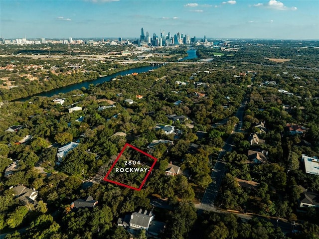 2804 Rock Way, Austin, TX 78746 - aerial overview of property's location featuring property boundaries highlighted, a nearby body of water, and city skyline