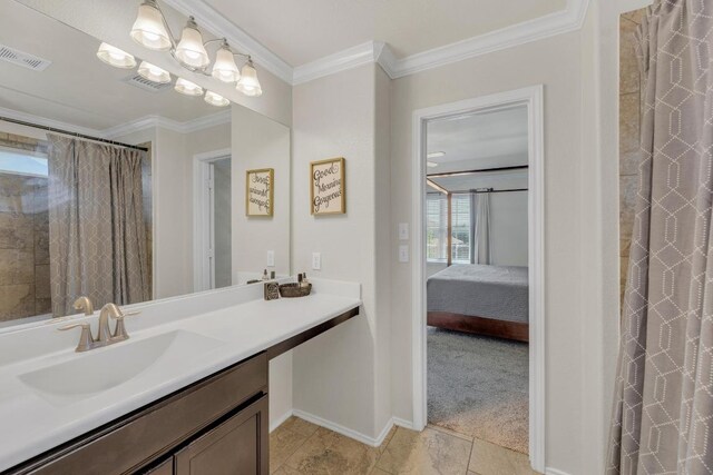 116 Bufflehead, Leander, TX 78641 - bathroom with vanity, ensuite bathroom, crown molding, a shower with shower curtain, and tile patterned floors