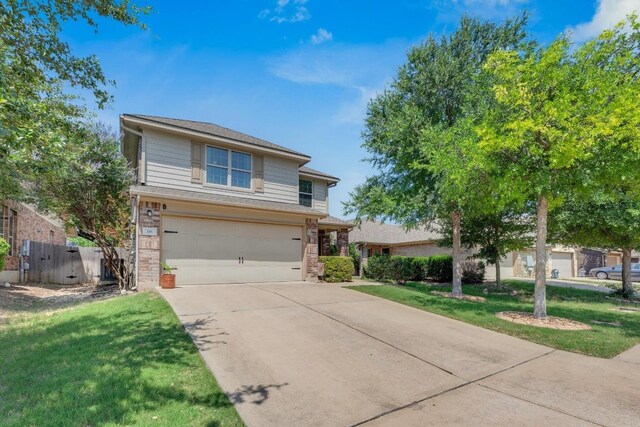 116 Bufflehead, Leander, TX 78641 - traditional-style home with brick siding, concrete driveway, and a garage