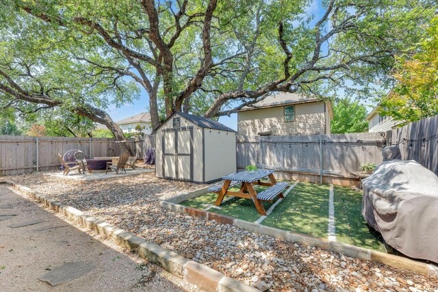 116 Bufflehead, Leander, TX 78641 - fenced backyard featuring a fire pit and a patio