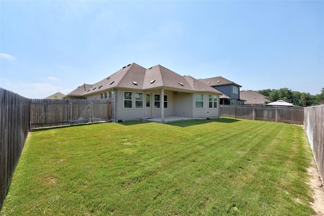 108 Windgate Dr, Hutto, TX 78634 - rear view of property with a patio area