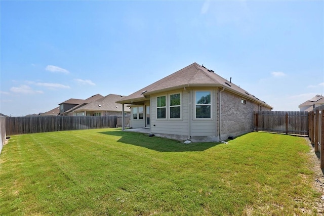 108 Windgate Dr, Hutto, TX 78634 - back of house with brick siding