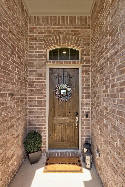 108 Windgate Dr, Hutto, TX 78634 - view of exterior entry featuring brick siding