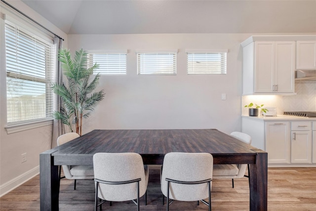 108 Windgate Dr, Hutto, TX 78634 - dining space featuring light wood-style floors, healthy amount of natural light, and lofted ceiling