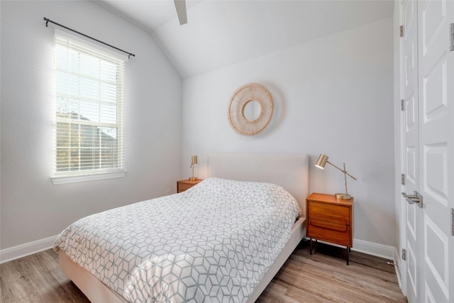 108 Windgate Dr, Hutto, TX 78634 - bedroom with vaulted ceiling, wood finished floors, baseboards, and ceiling fan